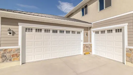 new white garage doors on home