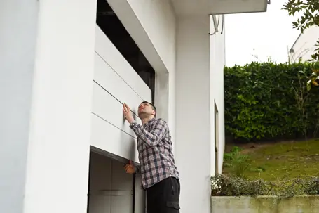 man checking his garage door