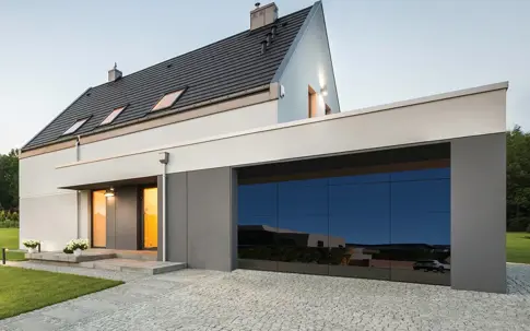 house with a mirrored glass garage door