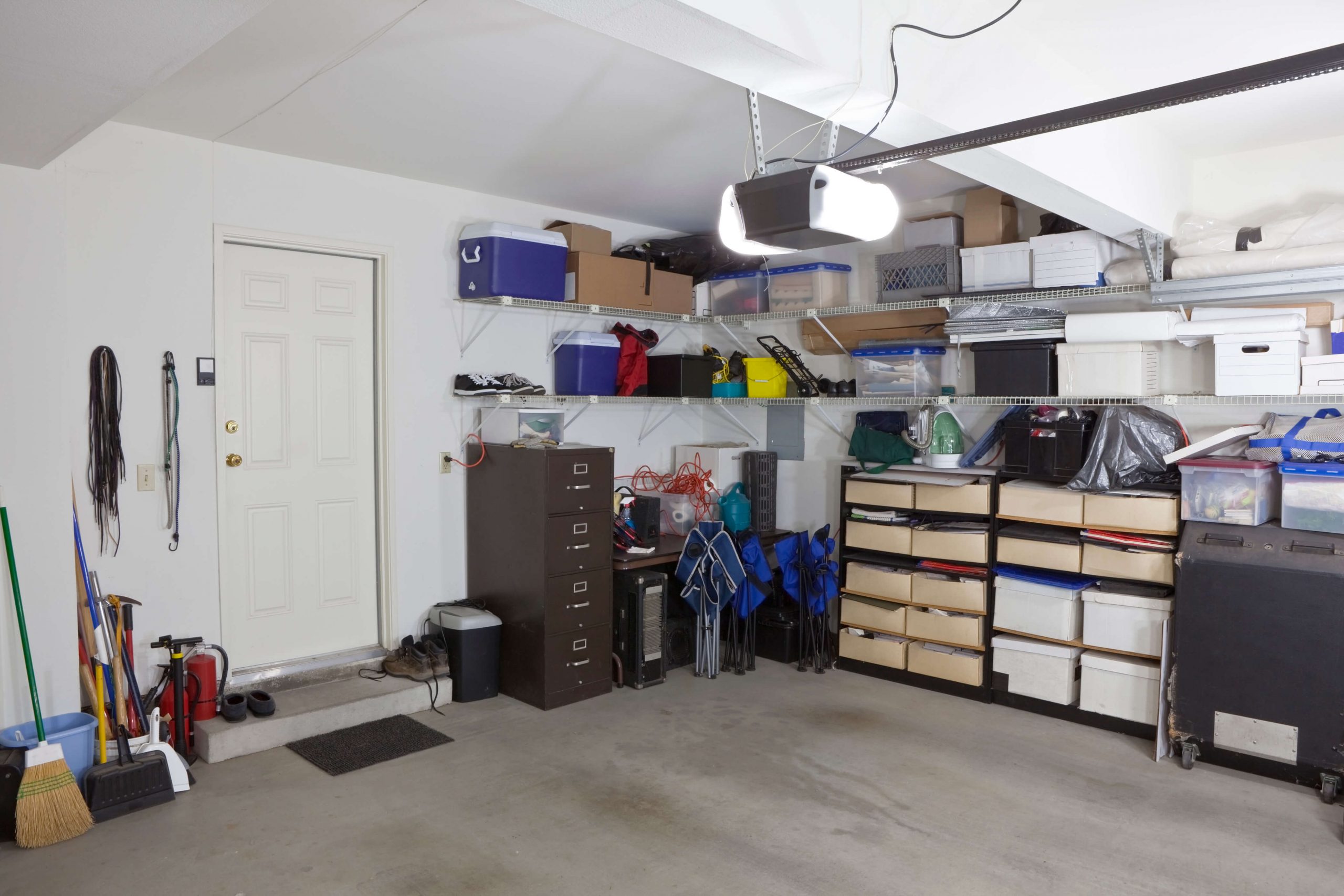 organized small garage interior with shelving units