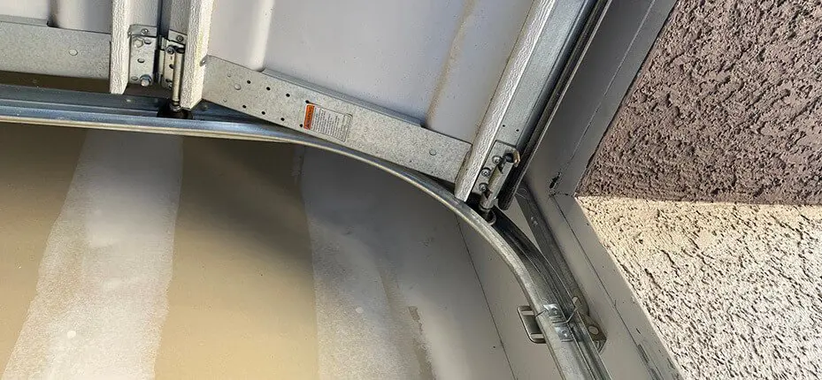 Close up of the rails of a garage door working.